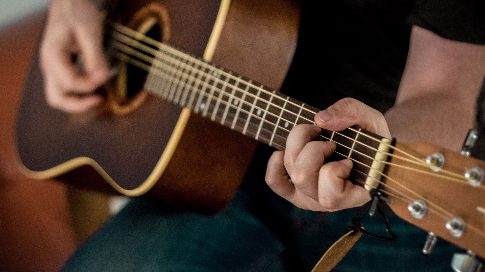 acoustic guitar being played